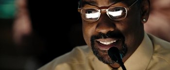 Movie still from “The Taking of Pelham 123” (2009), directed by Tony Scott – A person with a microphone; Extreme Close Up shot, Low angle