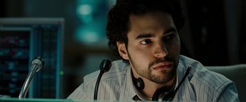 Movie still from “The Taking of Pelham 123” (2009), directed by Tony Scott – A person with a microphone; Close Up shot, Low angle