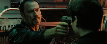 Movie still from “The Taking of Pelham 123” (2009), directed by Tony Scott – A man holding a gun up to a boy's face; Close Up shot, Over the shoulder angle