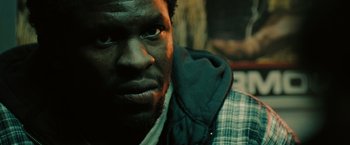 Movie still from “The Taking of Pelham 123” (2009), directed by Tony Scott – A person wearing a jacket; Close Up shot, Low angle