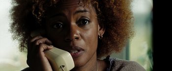 Movie still from “The Taking of Pelham 123” (2009), directed by Tony Scott – A person talking on a phone; Close Up shot, Low angle