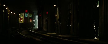 Movie still from “The Taking of Pelham 123” (2009), directed by Tony Scott – A couple of people standing next to a train track; Extreme Wide shot, Low angle