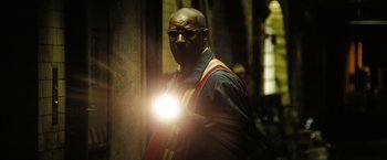 Movie still from “The Taking of Pelham 123” (2009), directed by Tony Scott – A man with a light in his hand; Close Up shot, Low angle