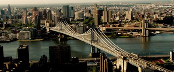 Movie still from “The Taking of Pelham 123” (2009), directed by Tony Scott – An aerial view of a bridge and a city skyline; Extreme Wide shot, High angle