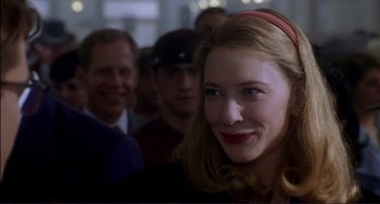 Movie still from “The Talented Mr. Ripley” (1999), directed by Anthony Minghella – A group of people standing in a room; Close Up shot, Over the shoulder angle