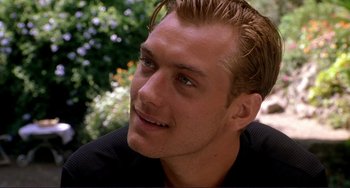 Movie still from “The Talented Mr. Ripley” (1999), directed by Anthony Minghella – A man's face with trees in the background; Close Up shot, Over the shoulder angle