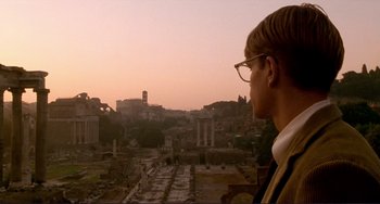 Movie still from “The Talented Mr. Ripley” (1999), directed by Anthony Minghella – A man looking out over the ruins of an ancient city; Wide shot, Over the shoulder angle