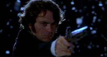 Movie still from “The Talented Mr. Ripley” (1999), directed by Anthony Minghella – A person holding a gun; Close Up shot, Low angle