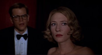 Movie still from “The Talented Mr. Ripley” (1999), directed by Anthony Minghella – A man and a woman in a dark room; Close Up shot, Over the shoulder angle