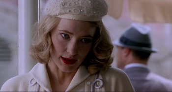 Movie still from “The Talented Mr. Ripley” (1999), directed by Anthony Minghella – A person wearing a hat; Close Up shot, Over the shoulder angle