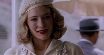 Movie still from “The Talented Mr. Ripley” (1999), directed by Anthony Minghella – A person wearing a hat; Close Up shot, Over the shoulder angle