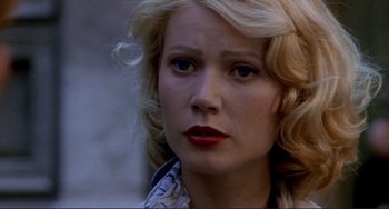 Movie still from “The Talented Mr. Ripley” (1999), directed by Anthony Minghella – A person with blonde curly hair; Close Up shot, Over the shoulder angle