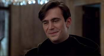 Movie still from “The Talented Mr. Ripley” (1999), directed by Anthony Minghella – A person wearing a black shirt; Close Up shot, Over the shoulder angle