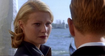 Movie still from “The Talented Mr. Ripley” (1999), directed by Anthony Minghella – A man and a woman standing next to a body of water; Close Up shot, Over the shoulder angle