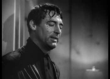 Movie still from “The Talk of the Town” (1942), directed by George Stevens – Black and white photograph of a man with wet hair; Close Up shot, Low angle