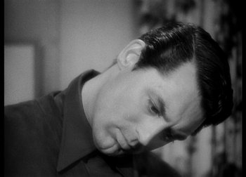 Movie still from “The Talk of the Town” (1942), directed by George Stevens – A black - and - white photo of a man's face; Close Up shot, Over the shoulder angle