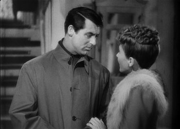 Movie still from “The Talk of the Town” (1942), directed by George Stevens – A black and white photo of a man and a woman; Close Up shot, Over the shoulder angle