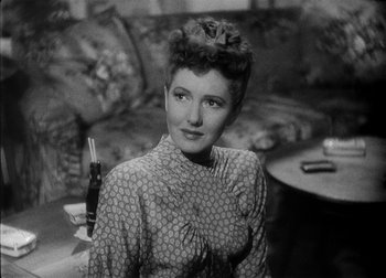 Movie still from “The Talk of the Town” (1942), directed by George Stevens – An old black and white photo of a woman; Close Up shot, High angle