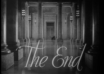 Movie still from “The Talk of the Town” (1942), directed by George Stevens – A black - and - white photo of the end of a building; Extreme Wide shot, Low angle