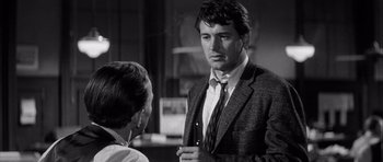 Movie still from “The Tarnished Angels” (1957), directed by Douglas Sirk – A black and white photo of a man and a woman talking; Close Up shot, Over the shoulder angle