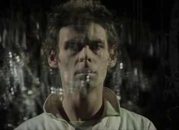 Movie still from “The Tempest” (1979), directed by Derek Jarman – A man with a cigarette in his mouth; Close Up shot, Low angle