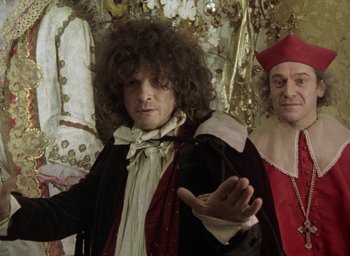 Movie still from “The Tempest” (1979), directed by Derek Jarman – Two men dressed up in renaissance costumes; Medium shot, Over the shoulder angle