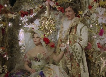Movie still from “The Tempest” (1979), directed by Derek Jarman – A man and a woman dressed in renaissance clothing; Medium shot, Low angle