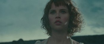 Movie still from “The Tempest” (2010), directed by Julie Taymor – A person wearing a white shirt; Close Up shot, Low angle