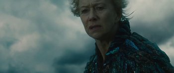 Movie still from “The Tempest” (2010), directed by Julie Taymor – An older woman is looking into the distance; Close Up shot, Low angle
