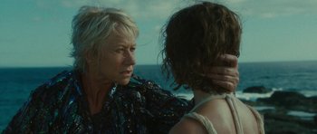Movie still from “The Tempest” (2010), directed by Julie Taymor – Two women standing next to each other near the ocean; Close Up shot, Over the shoulder angle