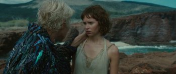 Movie still from “The Tempest” (2010), directed by Julie Taymor – A woman with her hand on her shoulder and another woman with her hand on her shoulder; Close Up shot, Over the shoulder angle