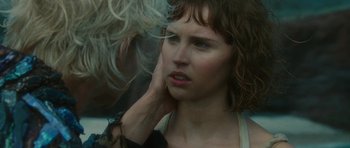 Movie still from “The Tempest” (2010), directed by Julie Taymor – A person holding their hand up to her face; Close Up shot, Over the shoulder angle