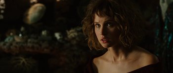 Movie still from “The Tempest” (2010), directed by Julie Taymor – A person wearing a brown shirt; Close Up shot, Over the shoulder angle