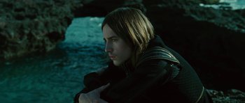 Movie still from “The Tempest” (2010), directed by Julie Taymor – A person sitting on the ground in the dark; Close Up shot, High angle