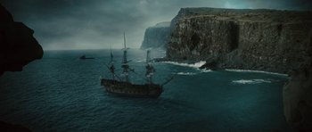 Movie still from “The Tempest” (2010), directed by Julie Taymor – A pirate ship in the water; Extreme Wide shot, High angle
