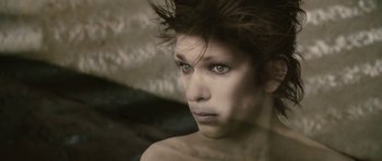 Movie still from “The Tempest” (2010), directed by Julie Taymor – A woman with green eyes looking at the camera; Close Up shot, High angle