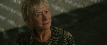 Movie still from “The Tempest” (2010), directed by Julie Taymor – An older woman is looking into the distance; Close Up shot, Low angle