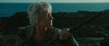 Movie still from “The Tempest” (2010), directed by Julie Taymor – A man with blonde hair holding a sword in his hand; Close Up shot, Low angle