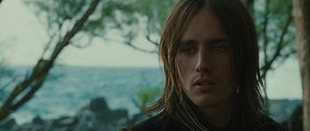 Movie still from “The Tempest” (2010), directed by Julie Taymor – A person with long brown hair; Close Up shot, Low angle