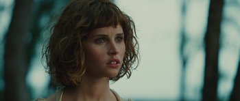 Movie still from “The Tempest” (2010), directed by Julie Taymor – A person wearing a white shirt; Close Up shot, Over the shoulder angle