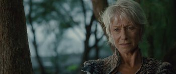 Movie still from “The Tempest” (2010), directed by Julie Taymor – An older woman with white hair looking at the camera; Close Up shot, Low angle