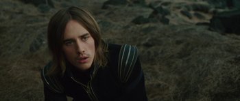 Movie still from “The Tempest” (2010), directed by Julie Taymor – A person with long brown hair; Close Up shot, Over the shoulder angle