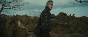 Movie still from “The Tempest” (2010), directed by Julie Taymor – An older man with a sword in his hand; Medium shot, Low angle