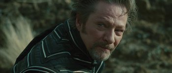 Movie still from “The Tempest” (2010), directed by Julie Taymor – A person wearing a leather jacket; Close Up shot, Low angle