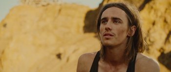 Movie still from “The Tempest” (2010), directed by Julie Taymor – A person with long brown hair; Close Up shot, Low angle