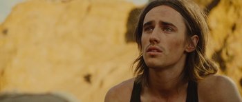 Movie still from “The Tempest” (2010), directed by Julie Taymor – A person with long brown hair; Close Up shot, Low angle