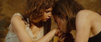 Movie still from “The Tempest” (2010), directed by Julie Taymor – A woman and a man touching their hands; Close Up shot, Over the shoulder angle