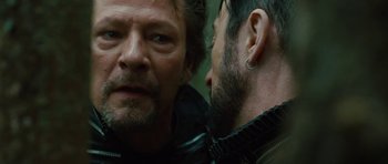 Movie still from “The Tempest” (2010), directed by Julie Taymor – A person with a person with a piercing; Close Up shot, Over the shoulder angle