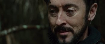 Movie still from “The Tempest” (2010), directed by Julie Taymor – A person with a beard; Close Up shot, Over the shoulder angle