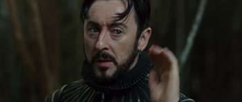 Movie still from “The Tempest” (2010), directed by Julie Taymor – A person with a beard; Close Up shot, Over the shoulder angle